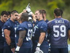 CFLPA president Jeff Keeping (seen in middle with the Argos in 2015) says if CFL free agents find themselves unable to make any bonus money this off-season, they will have other professional options such as the AAF or XFL. (Ernest Doroszuk/Postmedia file)