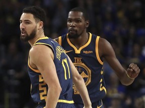 Golden State Warriors' Klay Thompson, left, and Kevin Durant will in Toronto to take on the Raptors on Thursday night.  (AP Photo/Ben Margot)