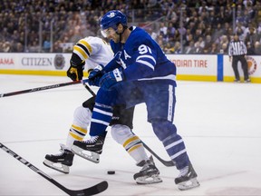 Maple Leafs centre John Tavares battles for the puck against the Bruins on Nov. 26, 2018 at Scotiabank Arena. ERNEST DOROSZUK/TORONTO SUN
