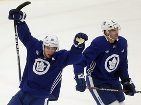 Mitch Marner celebrates a goal with John Tavares during Leafs practice at the Mastercard Centre in Toronto. (Dave Abel/Toronto Sun)
