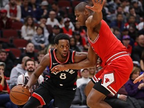 Jordan Loyd of the Raptors, left, in action against Chicago on Saturday. GETTY IMAGES