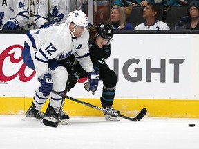 Toronto Maple Leafs center Patrick Marleau (12) battles for the puck against San Jose Sharks left wing Marcus Sorensen (20) during the third period of an NHL hockey game in San Jose, Calif., Thursday, Nov. 15, 2018. Toronto Maple Leafs won 5-3.