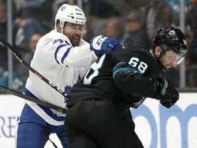 Toronto Maple Leafs center Nazem Kadri (43) fight with San Jose Sharks center Melker Karlsson (68) during the third period of an NHL hockey game in San Jose, Calif., Thursday, Nov. 15, 2018. Toronto won 5-3.