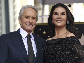 Actor Michael Douglas, left, and his wife Catherine Zeta-Jones attend a ceremony honoring Douglas with a star on the Hollywood Walk of Fame on Tuesday, Nov. 6, 2018, in Los Angeles.