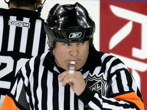 Referee Mick McGeough signals the re-starting of play after he disallowed Edmonton Oilers' Ales Hemsky's game-tying-goal against the Dallas Stars during third period NHL action in Edmonton, Alta., on Friday November 3, 2006. (Sun files)