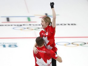 Canada's Kaitlyn Lawes and John Morris celebrate their gold medal win against Switzerland during the Mixed Doubles Curling at the 2018 Winter Olympic Games, in Gangneung, South Korea, on Tuesday Feb. 13, 2018.