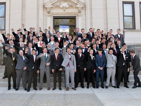 In this May 2018 photo provided by Peter Gust, a group of Wisconsin high school boys stand on the steps outside the Sauk County Courthouse in Baraboo, Wis.