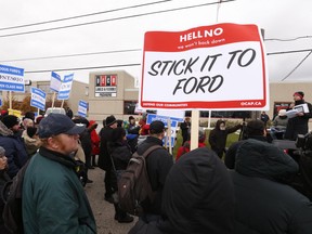 OCAP holds Raise the Rates rally outside the headquarters of Deco Signs, owned and operated by the Ford family, on Saturday November 17, 2018. (Jack Boland/Toronto Sun/Postmedia Network)