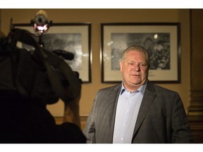 Ontario Premier Doug Ford leaves an early morning PC Caucus meeting at the Ontario Legislature in Toronto on Thursday, November 29, 2018. (Chris Young/The Canadian Press)