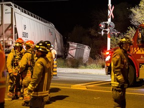 Emergency personnel at the scene of a train derailment.
(JOHN HANLEY  PHOTO)