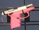 A pink handgun was among 25 firearms allegedly found stashed in the gas tank of a vehicle that attempted to cross the border into Canada at Fort Erie recently. (Joe Warmington/Toronto Sun/Postmedia Network)
