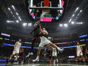 Toronto Raptors' Pascal Siakam shoots past Milwaukee Bucks' Ersan Ilyasova during the first half of an NBA basketball game Monday, Oct. 29, 2018, in Milwaukee. (AP Photo/Morry Gash) ORG XMIT: WIMG111