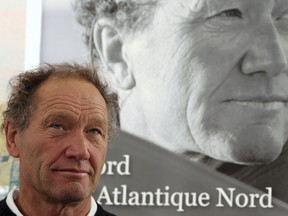 FILE - In this Monday, June 17, 2013 file picture French skipper Francis Joyon answers questions during a press conference held in Brest, western France. Veteran French skipper Francis Joyon has won the Route du Rhum solo race across the Atlantic in the closest finish since the race inception in 1978.