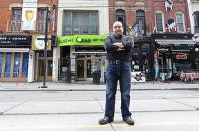 Robert Garabedian, owner of Maki My Way outside his restaurant on King St during the King St. TTC pilot project that is driving business away in Toronto. (Dave Abel/Toronto Sun)