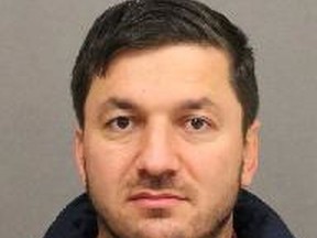 Senol Komec, 38, of Vaughan, faces multiple charges of sexual assault and forcible confinement stemming from allegations made by female passengers. (Toronto Police handout)