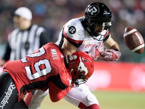 Calgary Stampeders defensive back Jamar Wall hits Ottawa Redblacks wide receiver Brad Sinopoli during the second half of the 106th Grey Cup in Edmonton Sunday, Nov. 25, 2018.