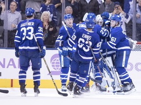 Maple Leafs goaltender Garret Sparks is congratulated by his teammates after picking up the shutout in a 6-0 win over Philadelphia on Saturday night. (Chris Young/The Canadian Press)