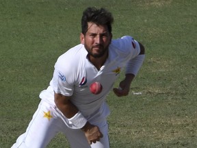 Pakistan's bowler Yasir Shah bowls during a cricket test match against New Zealand in Dubai, United Arab Emirates on  Nov. 27, 2018. (Martin Dokoupil/AP)