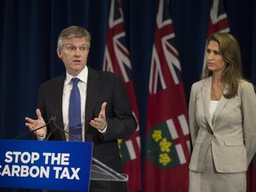 Ontario Minister of the Environment Rod Phillips and Attorney General Caroline Mulroney  at a press conference  Queen's Park  in Toronto, Ont. on Thursday August 2, 2018. (Stan Behal/Toronto Sun)