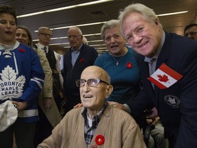 98 year old Veteran Angelo Molinas got to hang out with Toronto Maple Leafs players and alumni on Wednesday, including Darryl Sittler, at Sunnybrook Veterans Centre. (Stan Behal/Toronto Sun)