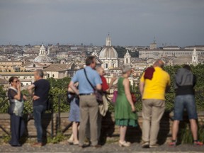 Visitors look across the skyline in Rome on May 12, 2018. (Bloomberg photo by Giulio Napolitano)