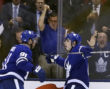 Fans cheer as the Toronto Maple Leafs center John Tavares (91) scores with Toronto Maple Leafs right wing Mitchell Marner (16) on Monday November 19, 2018.The Toronto Maple Leafs host the Columbus Blue Jackets at the Scotiabank Arena in Toronto, On. Veronica Henri/Toronto Sun/Postmedia Network