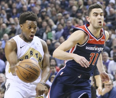 Toronto Raptors guard Kyle Lowry (7) and Washington Wizards guard Tomas Satoransky (31) on Friday November 23, 2018. The Toronto Raptors host the Washington Wizards at the Scotiabank Arena in Toronto, Ont. Veronica Henri/Toronto Sun/Postmedia Network