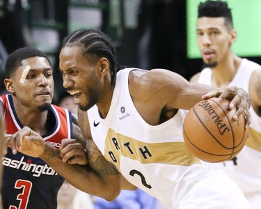 Toronto Raptors forward Kawhi Leonard (2) and Washington Wizards guard Bradley Beal (3) on Friday November 23, 2018. The Toronto Raptors host the Washington Wizards at the Scotiabank Arena in Toronto, Ont. Veronica Henri/Toronto Sun/Postmedia Network