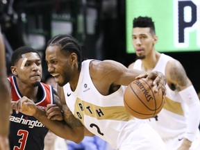 Raptors’ Kawhi Leonard gets around the Wizards’ guard Bradley Beal at the Scotiabank Arena last night. Veronica Henri/Toronto Sun