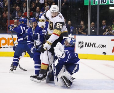 Toronto Maple Leafs Frederik Andersen G (31) just gets his glove on a shot as Vegas Golden Knights Tomas Nosek C (92) is pushed into him during the second period in Toronto on Tuesday November 6, 2018. Jack Boland/Toronto Sun/Postmedia Network