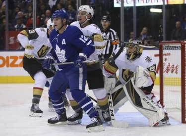 Vegas Golden Knights Erik Haula LW (56) clears Toronto Maple Leafs Patrick Marleau C (12) from in front of  Marc-Andre Fleury G (29) during the first period in Toronto on Wednesday November 7, 2018. Jack Boland/Toronto Sun/Postmedia Network