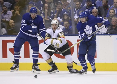 Vegas Golden Knights Erik Haula LW (56)battles for the puck with Toronto Maple Leafs Frederik Gauthier C (33) and Nikita Zaitsev D (22) during the second period in Toronto on Wednesday November 7, 2018. Jack Boland/Toronto Sun/Postmedia Network
