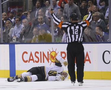 Vegas Golden Knights Erik Haula LW (56) withes in pain after getting hit by Toronto Maple Leafs Patrick Marleau C (12) catching his skate in the dasher boards during the third period in Toronto on Wednesday November 7, 2018. Jack Boland/Toronto Sun/Postmedia Network