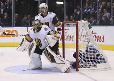 Vegas Golden Knights Colin Miller D (6) and  Marc-Andre Fleury G (29) with Toronto Maple Leafs Mitch Marner RW (16)  shot during the third period in Toronto on Wednesday November 7, 2018. Jack Boland/Toronto Sun/Postmedia Network