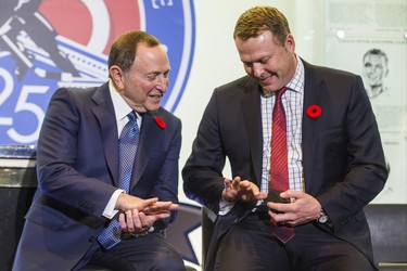 The 2018 Inductees into the Hockey Hall of Fame - Gary Bettman (left) and Martin Brodeur looks at their rings during a presentation at the Hockey Hall of Fame in Toronto, Ont. on Friday November 9, 2018.  Ernest Doroszuk/Toronto Sun/Postmedia