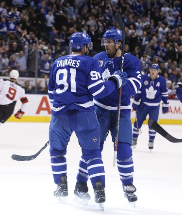 Toronto Maple Leafs John Tavares C (91) celebrates his first goal of the game with teammate Ron Hainsey D (2) during the first period in Toronto on Friday November 9, 2018. Jack Boland/Toronto Sun/Postmedia Network