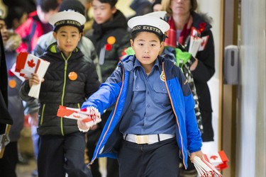 Navy cadet Ivan Liu, 9, is one of over 400 volunteers ready to place 47,500 Canadian flags on the lawns outside of Sunnybrook Veterans Centre on the grounds at Sunnybrook Health Sciences Centre in Toronto, Ont. on Saturday November 10, 2018. There were 100 flags for each of the 475 veterans that live there. Ernest Doroszuk/Toronto Sun/Postmedia