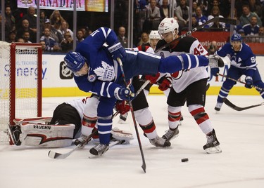 New Jersey Devils Brett Seney LW (43) pushes Toronto Maple Leafs Zach Hyman C (11) off the puck during the first period in Toronto on Friday November 9, 2018. Jack Boland/Toronto Sun/Postmedia Network