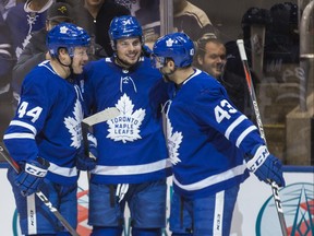Toronto Maple Leafs Auston Matthews celebrates his goal joined by Morgan Rielly (left) and Nazem Kadri (right) on November 28, 2018. Ernest Doroszuk/Toronto Sun