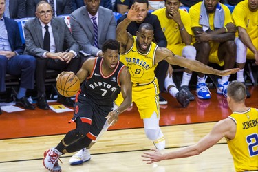 Toronto Raptors Kyle Lowry during overtime action against the Golden State Warriors Andre Iguodala at the Scotiabank Arena in Toronto, Ont. on Thursday November 29, 2018. Ernest Doroszuk/Toronto Sun/Postmedia