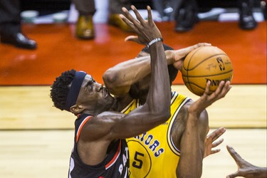 Toronto Raptors Pascal Siakam during overtime action against the Golden State Warriors Kevon Looney at the Scotiabank Arena in Toronto, Ont. on Thursday November 29, 2018. Ernest Doroszuk/Toronto Sun/Postmedia