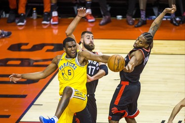 Toronto Raptors Jonas Valanciunas (left) and Kawhi Leonard during 2nd half action against Golden State Warriors Kevon Looney at the Scotiabank Arena in Toronto, Ont. on Thursday November 29, 2018. Ernest Doroszuk/Toronto Sun/Postmedia