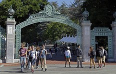 In this April 21, 2017, file photo, students walk past Sather Gate on the University of California, Berkeley campus in Berkeley, Calif. (AP Photo/Ben Margot, File)
