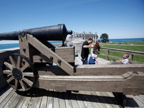 Children play on the grounds of Old Fort Niagara in Youngstown, N.Y., with the Niagara River in the background. Attendance at the fort has more than tripled since 2011. (David Duprey/Associated Press)