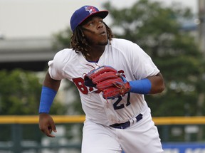 Buffalo Bisons' Vladimir Guerrero Jr. chases a foul ball hit by a Lehigh Valley IronPigs batter during the first inning of his triple-A debut with the affiliate of the Toronto Blue Jays on Tuesday, July 31, 2018, in Buffalo N.Y. (AP PHOTO)