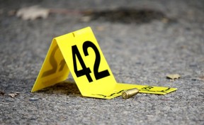 A shell casing found on the street as Toronto Police investigate a fatal shooting on Ann Arbour Rd. on Wednesday, Nov. 14, 2018. (Dave Abel/Toronto Sun)
