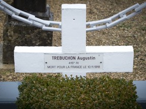 In this photo taken on Tuesday, Oct. 30, 2018, the grave marker of French WWI soldier Augustin Trebuchon in Vrigne-Meuse, France.