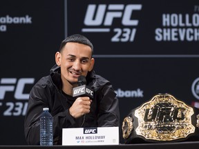 Max Holloway UFC featherweight champion speaks at a news conference in Toronto on Wednesday. (THE CANADIAN PRESS)