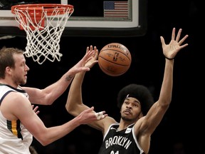Brooklyn Nets centre Jarrett Allen (right) will match up with Raptors big man Jonas Valanciunas on Friday night. (AP PHOTO)