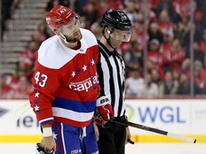 Tom Wilson of the Washington Capitals is escorted off the ice after his second-period hit on Brent Seney of the New Jersey Devils at Capital One Arena on November 30, 2018 in Washington,. (Photo by Will Newton/Getty Images)